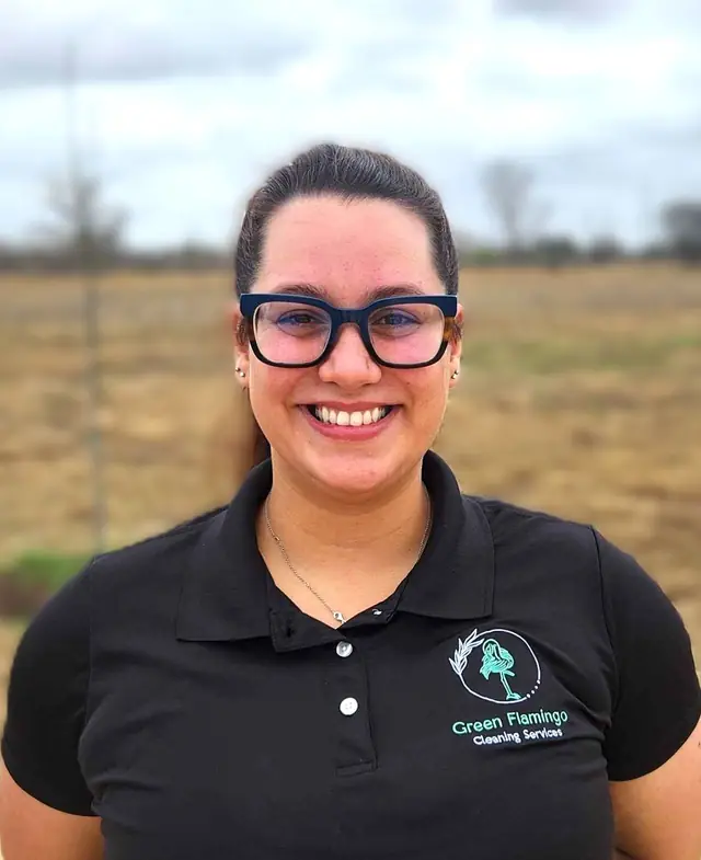 Jaylytsa M in the black Green Flamingo polo, standing outdoors