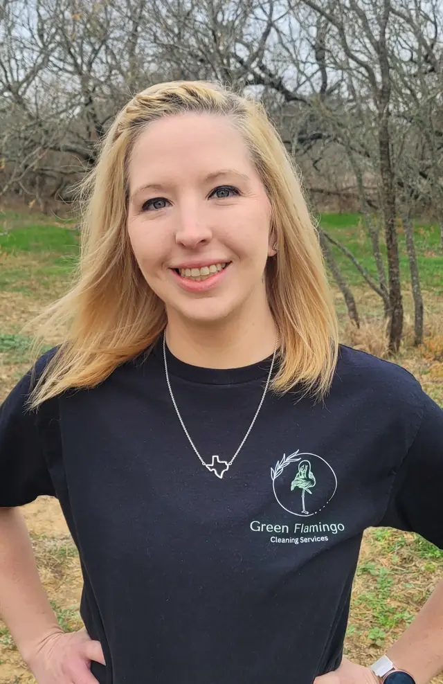 A Green Flamingo technician outdoors in the crew polo